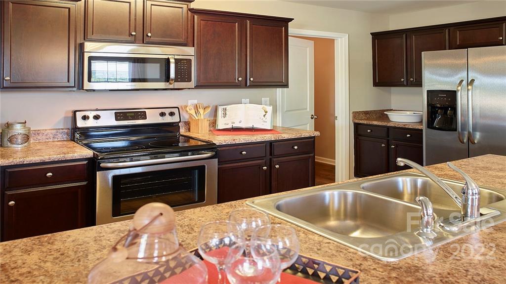 304 Gaines Road Clover, SC 29710 - Photo 37 of 48 a kitchen with a stove and a microwave