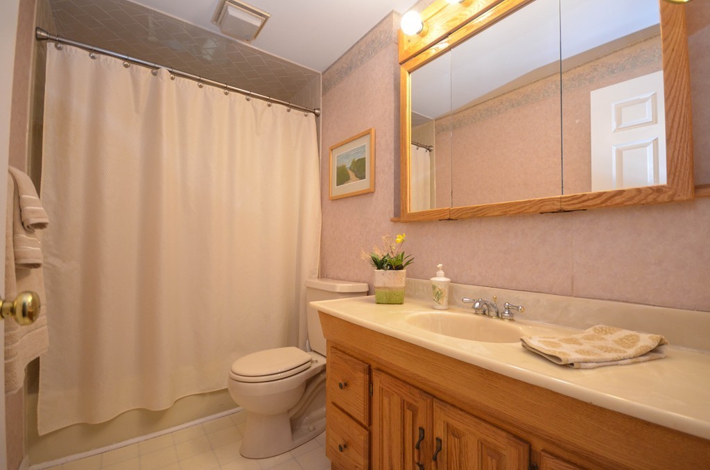211 Mason Road Northbridge, MA 01588 - Photo 16 of 25 a bathroom with a granite countertop sink a toilet and a mirror