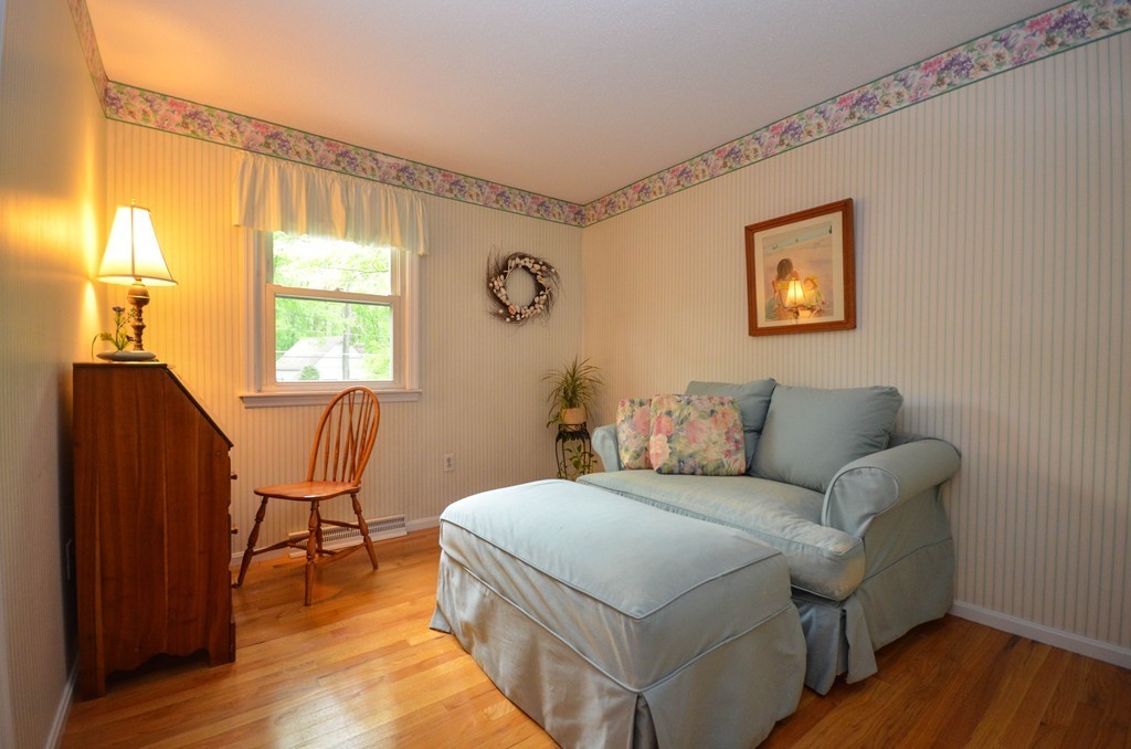 211 Mason Road Northbridge, MA 01588 - Photo 17 of 25 a living room with a couch and a dresser next to a window