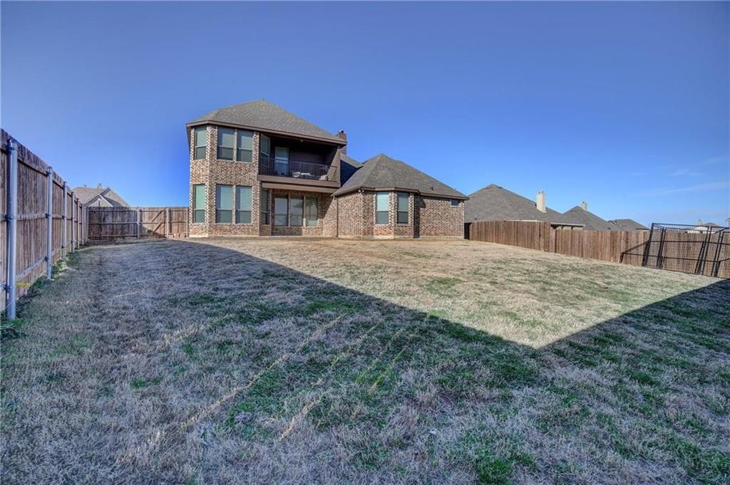 3206 Meadow Ridge Drive Midlothian, TX 76065 - Photo 34 of 37 a front view of a house with a yard