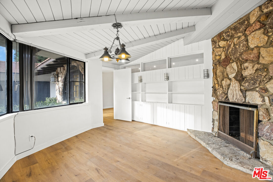 2254 Stradella Road Los Angeles, CA 90077 - Photo 14 of 27 a view of a livingroom with a fireplace