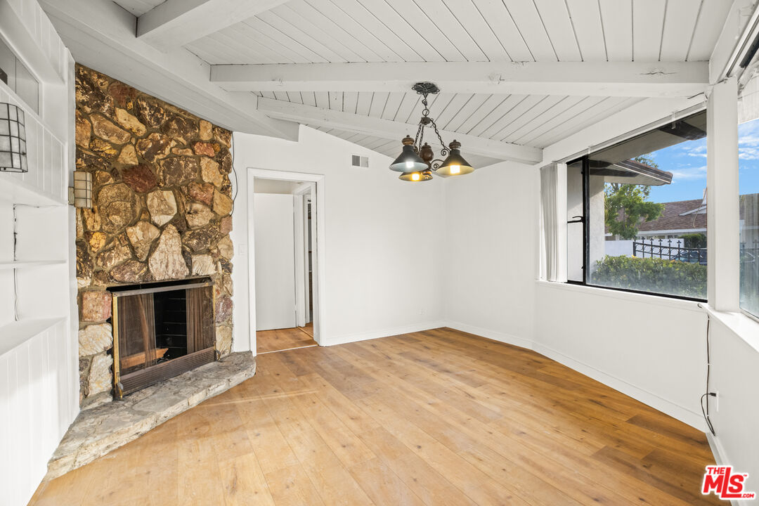 2254 Stradella Road Los Angeles, CA 90077 - Photo 15 of 27 a bedroom with a bed and a fireplace