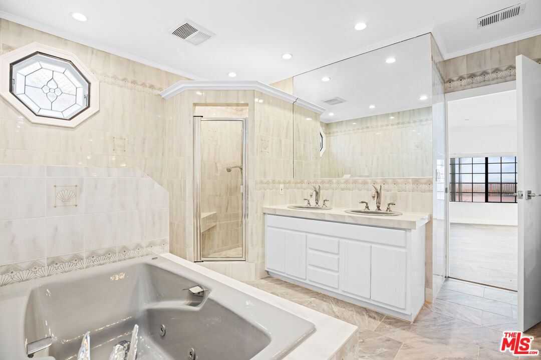 2254 Stradella Road Los Angeles, CA 90077 - Photo 22 of 27 a bathroom with a bathtub and a sink