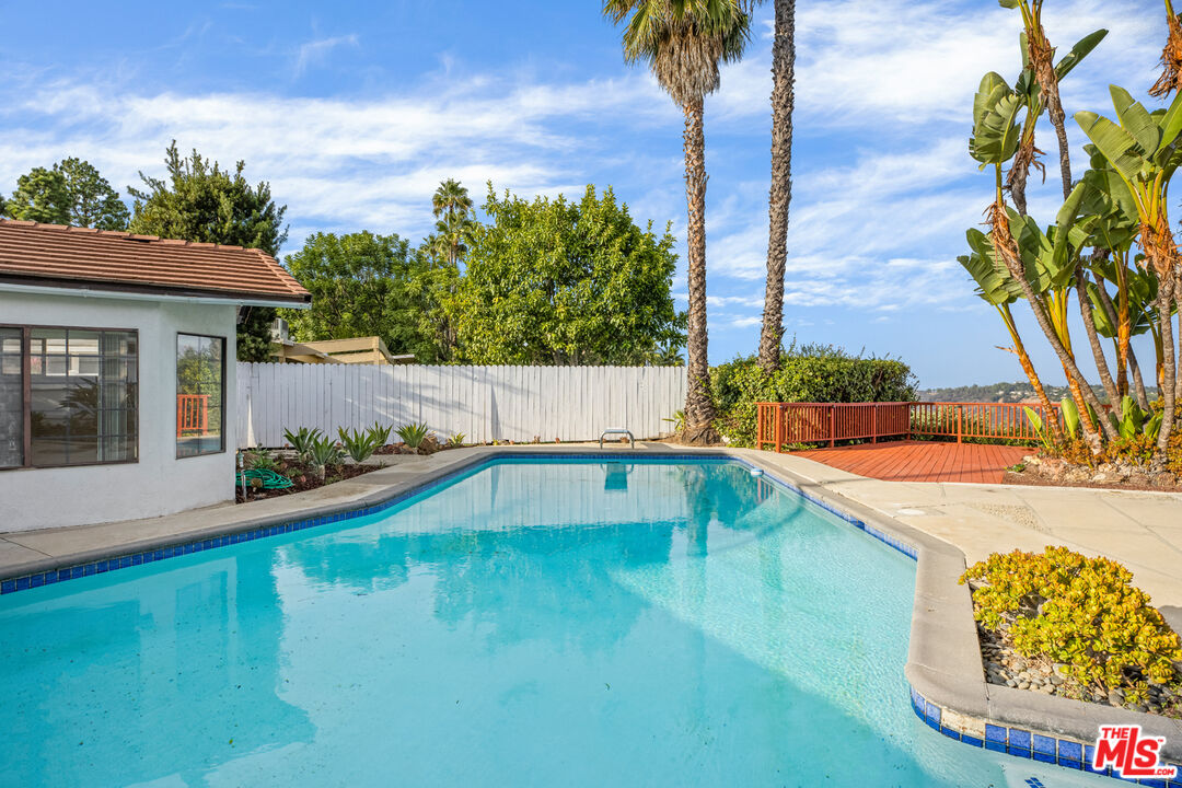 2254 Stradella Road Los Angeles, CA 90077 - Photo 26 of 27 a view of swimming pool with a yard