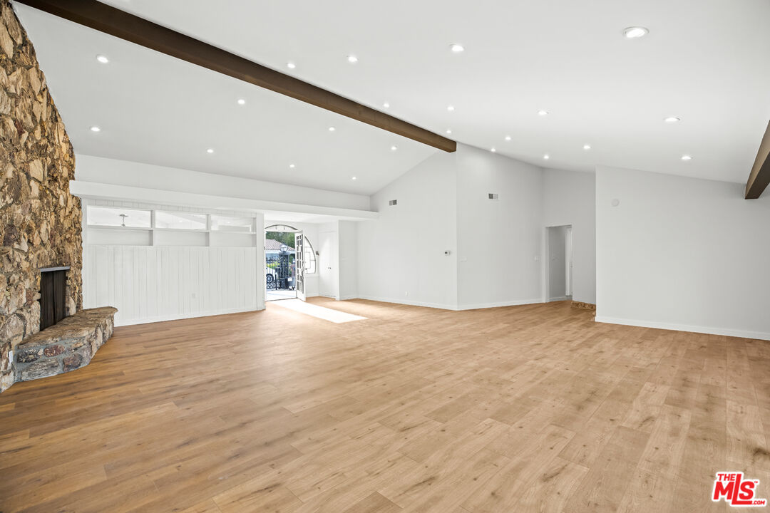 2254 Stradella Road Los Angeles, CA 90077 - Photo 10 of 27 a view of empty room with wooden floor