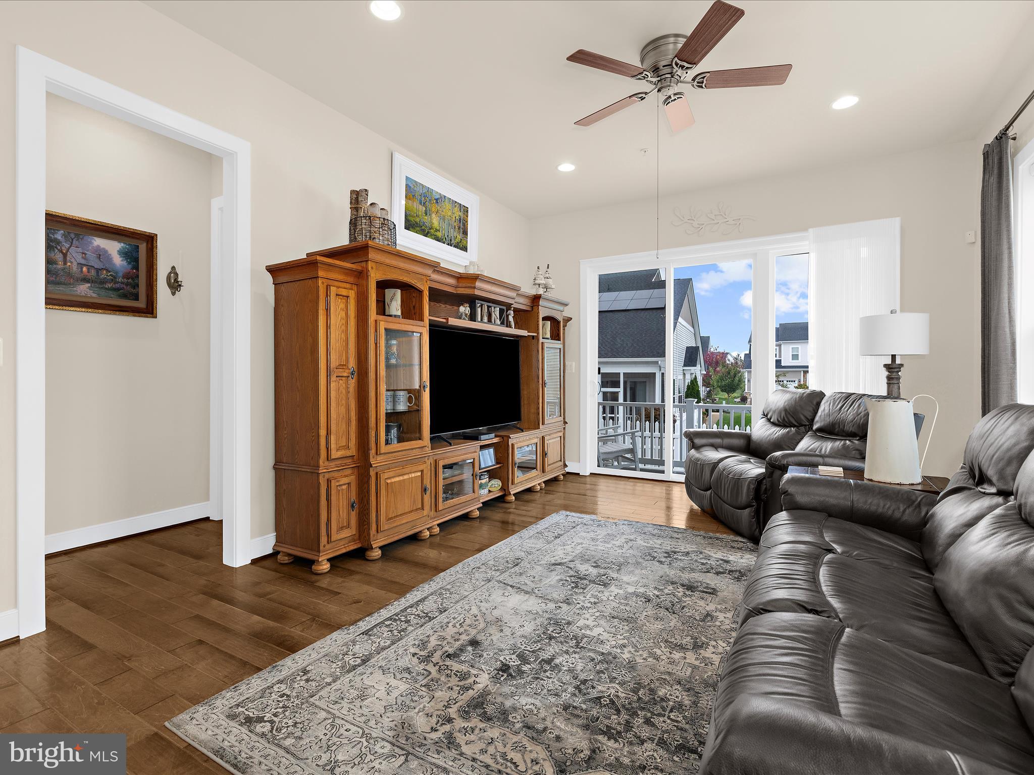 1530 Yellow Sand Lane Odenton, MD 21113 - Photo 11 of 87 a living room with furniture and a flat screen tv