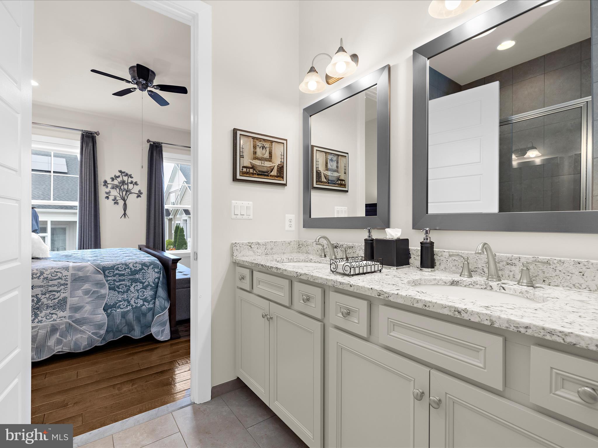1530 Yellow Sand Lane Odenton, MD 21113 - Photo 26 of 87 a en suite bathroom with a double vanity sink and a mirror