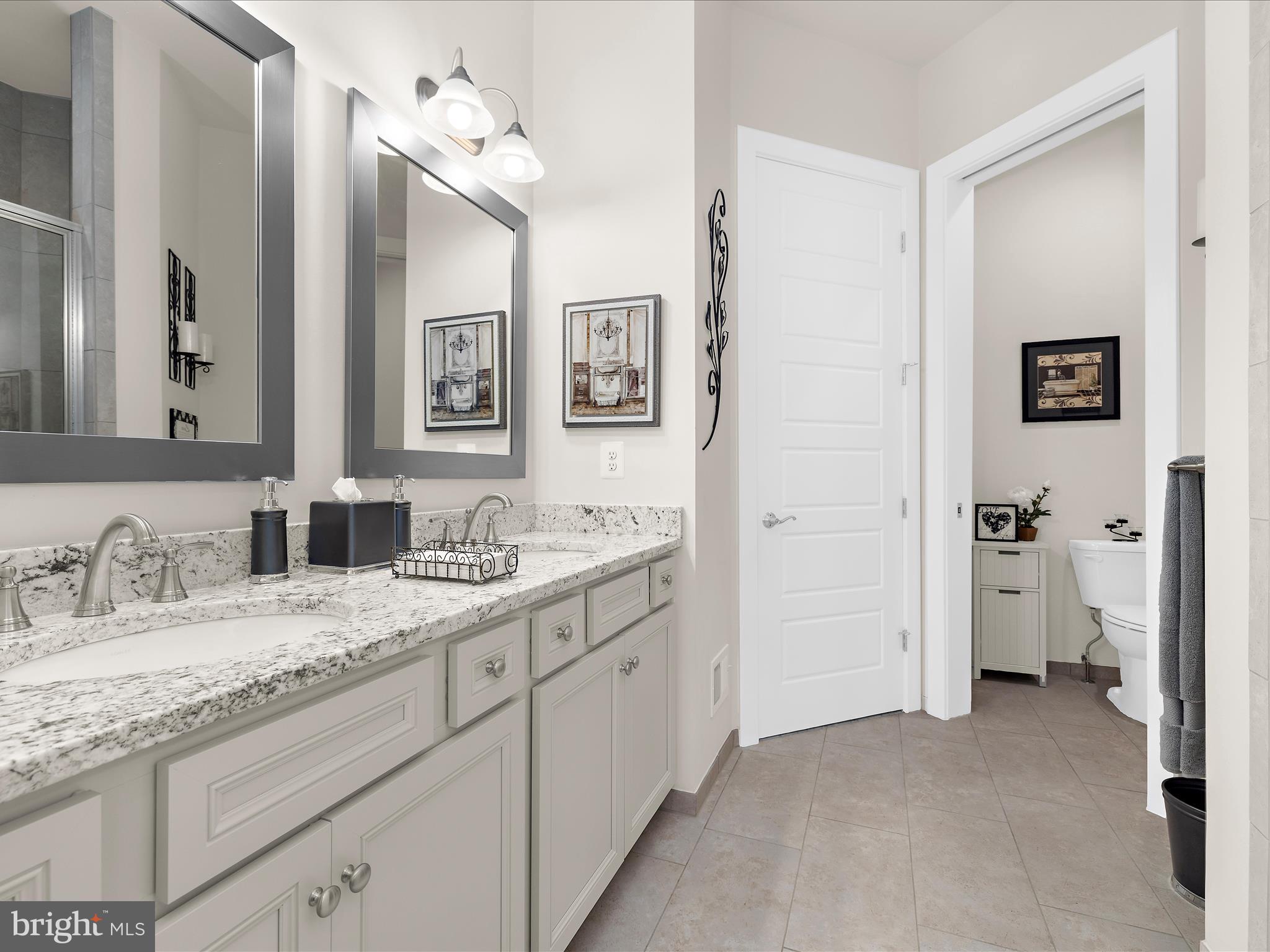 1530 Yellow Sand Lane Odenton, MD 21113 - Photo 27 of 87 a en suite bathroom with a granite countertop sink and a mirror