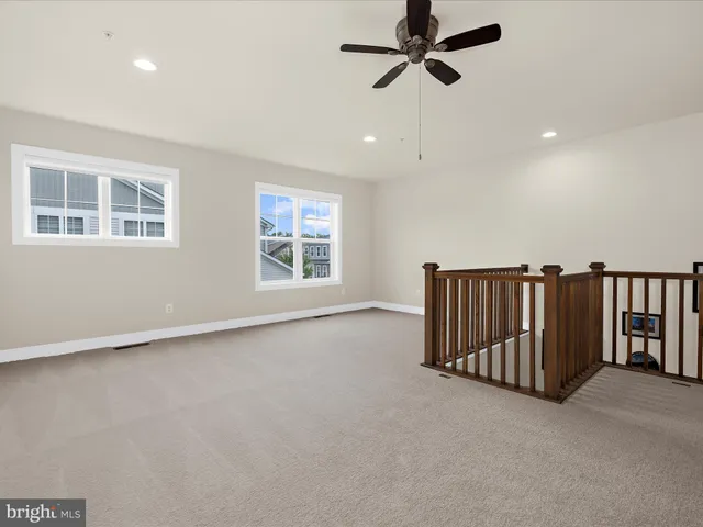 a view of house with backyard and sitting area