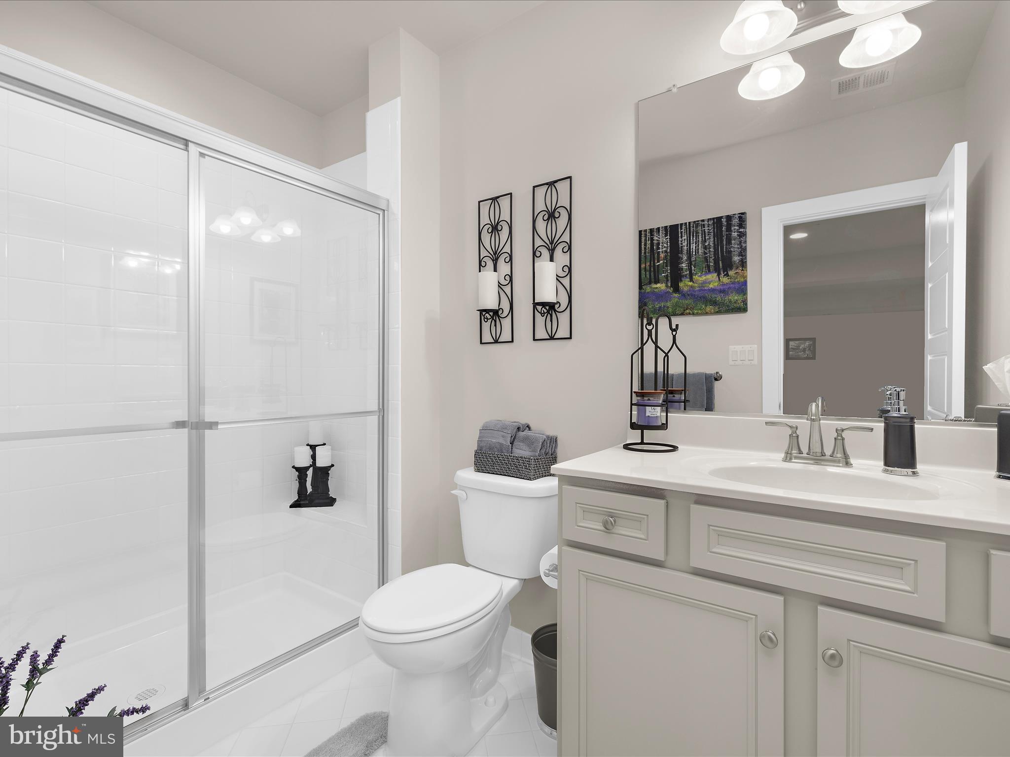 1530 Yellow Sand Lane Odenton, MD 21113 - Photo 49 of 87 a bathroom with a sink a toilet and a mirror