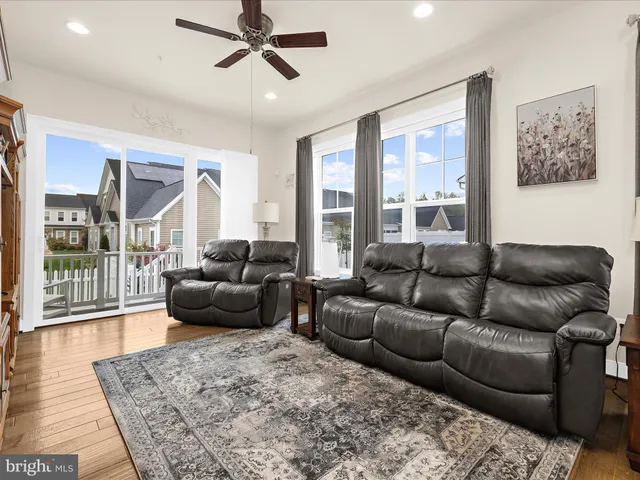 a kitchen with kitchen island a dining table chairs cabinets and a counter top space