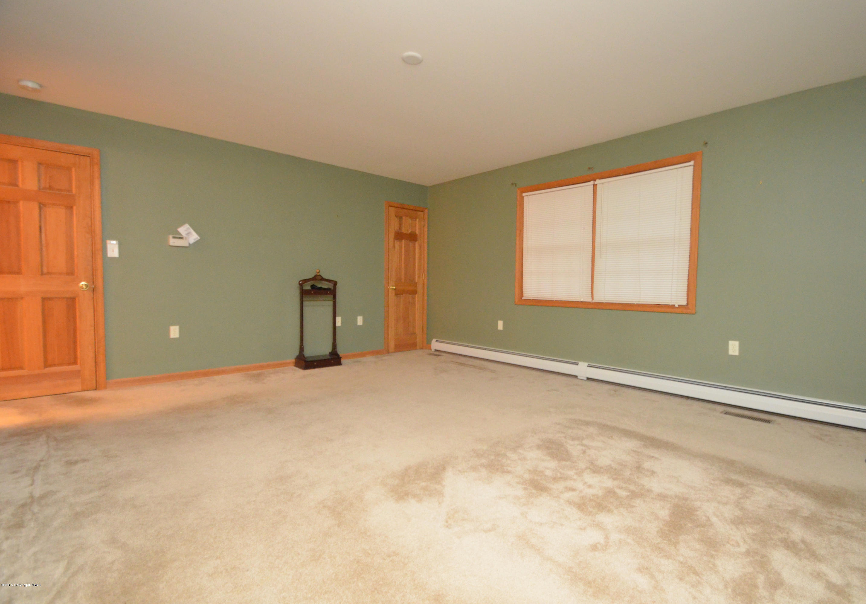 699 Buckle Boot Road Henryville, PA 18332 - Photo 15 of 26 a view of an empty room with a window