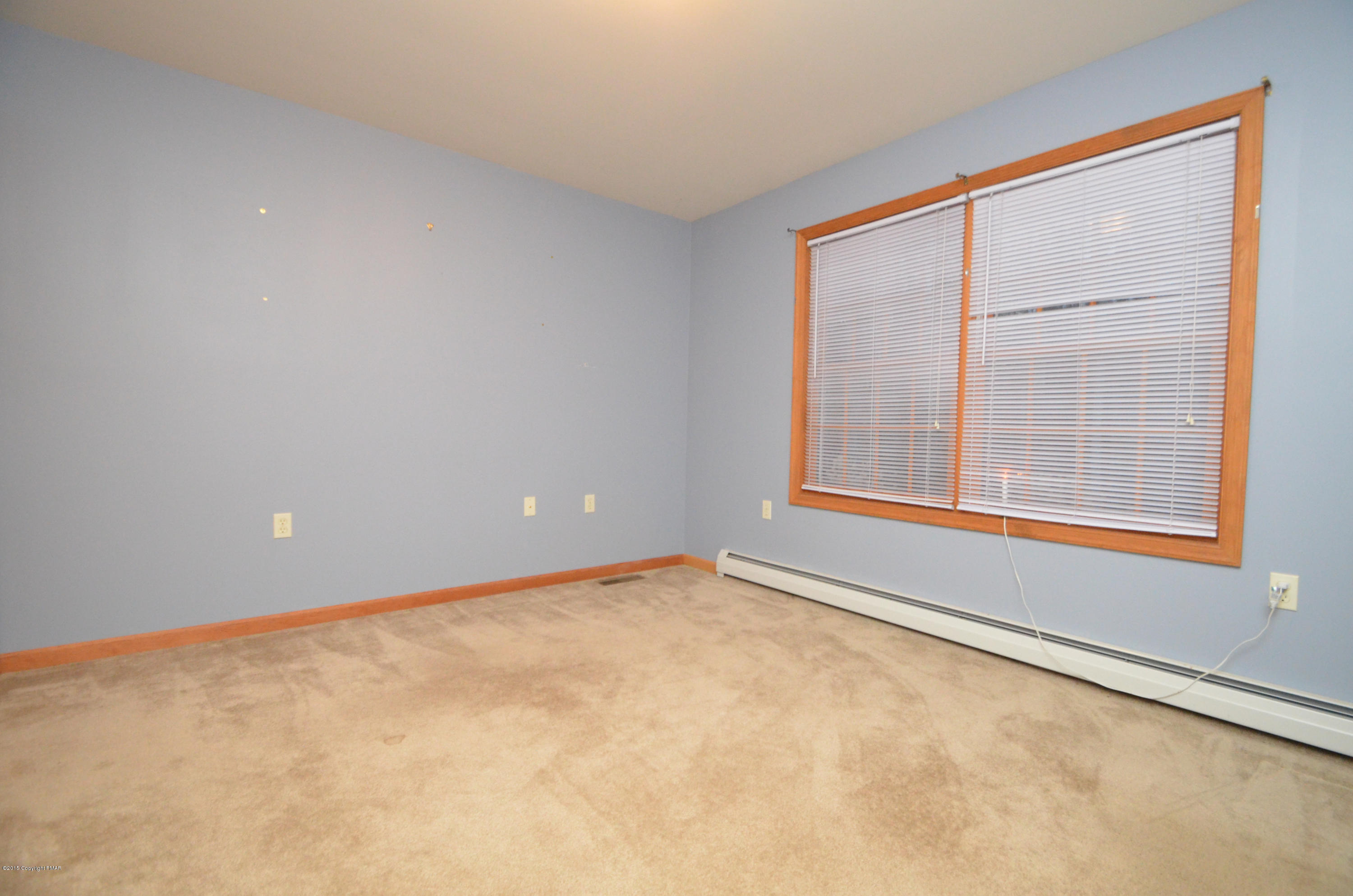 699 Buckle Boot Road Henryville, PA 18332 - Photo 19 of 26 an empty room with a window