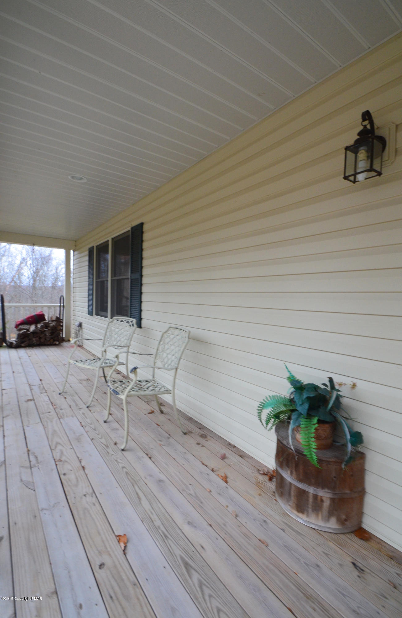 699 Buckle Boot Road Henryville, PA 18332 - Photo 2 of 26 a view of a chairs and table on the wooden floor