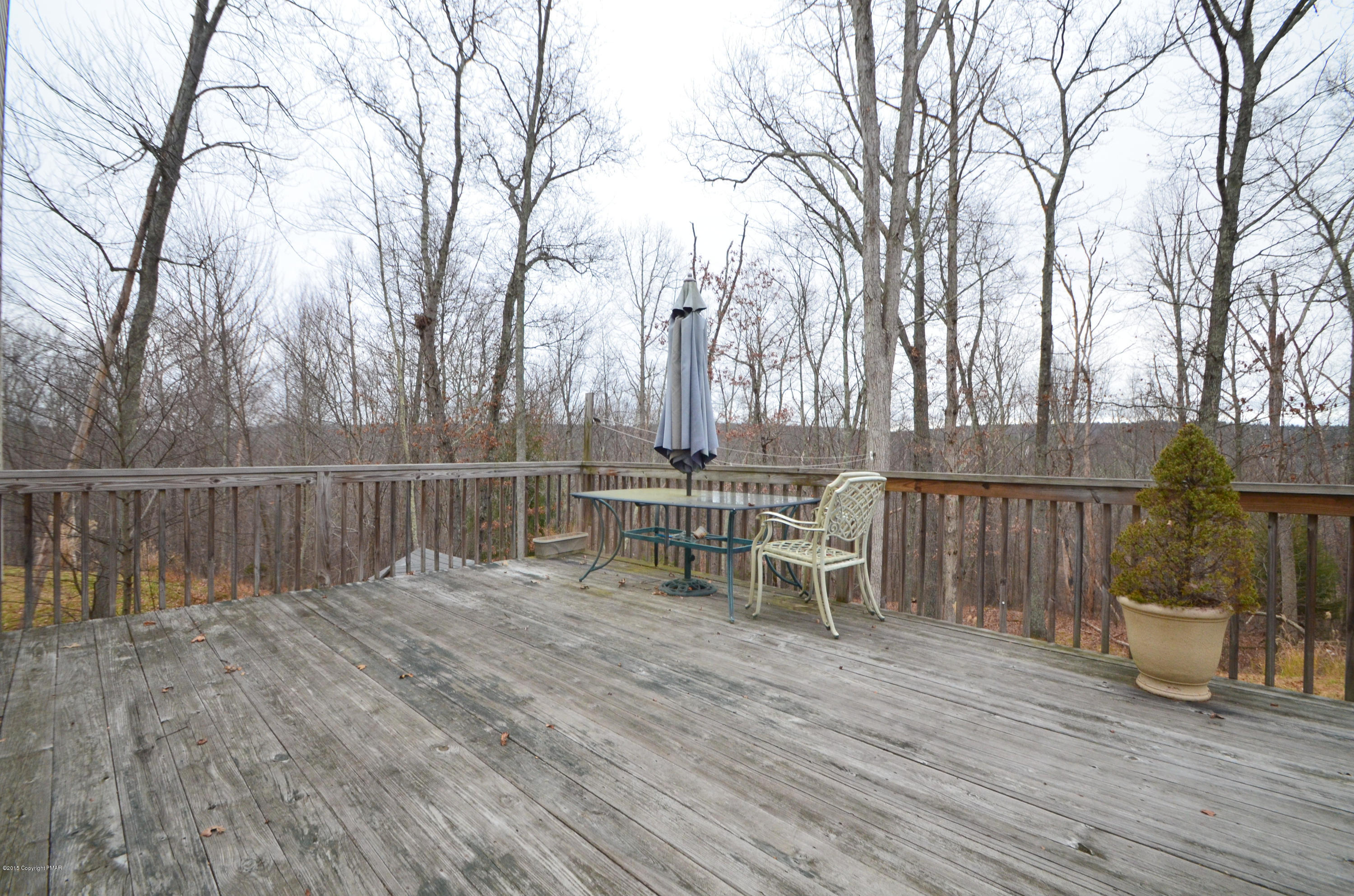 699 Buckle Boot Road Henryville, PA 18332 - Photo 22 of 26 a view of a chairs and table on the wooden floor