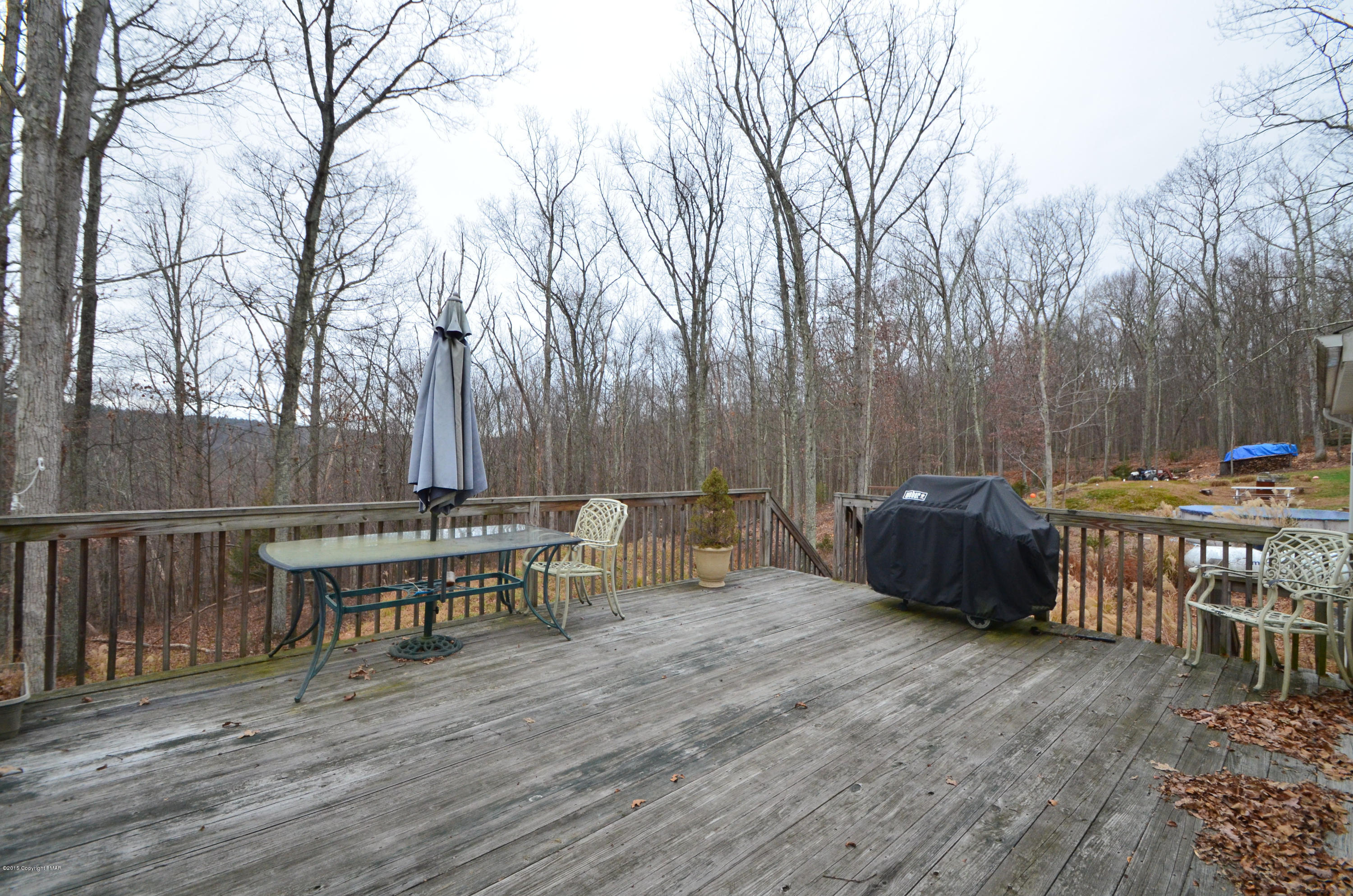 699 Buckle Boot Road Henryville, PA 18332 - Photo 23 of 26 a view of a chairs and table on the wooden floor