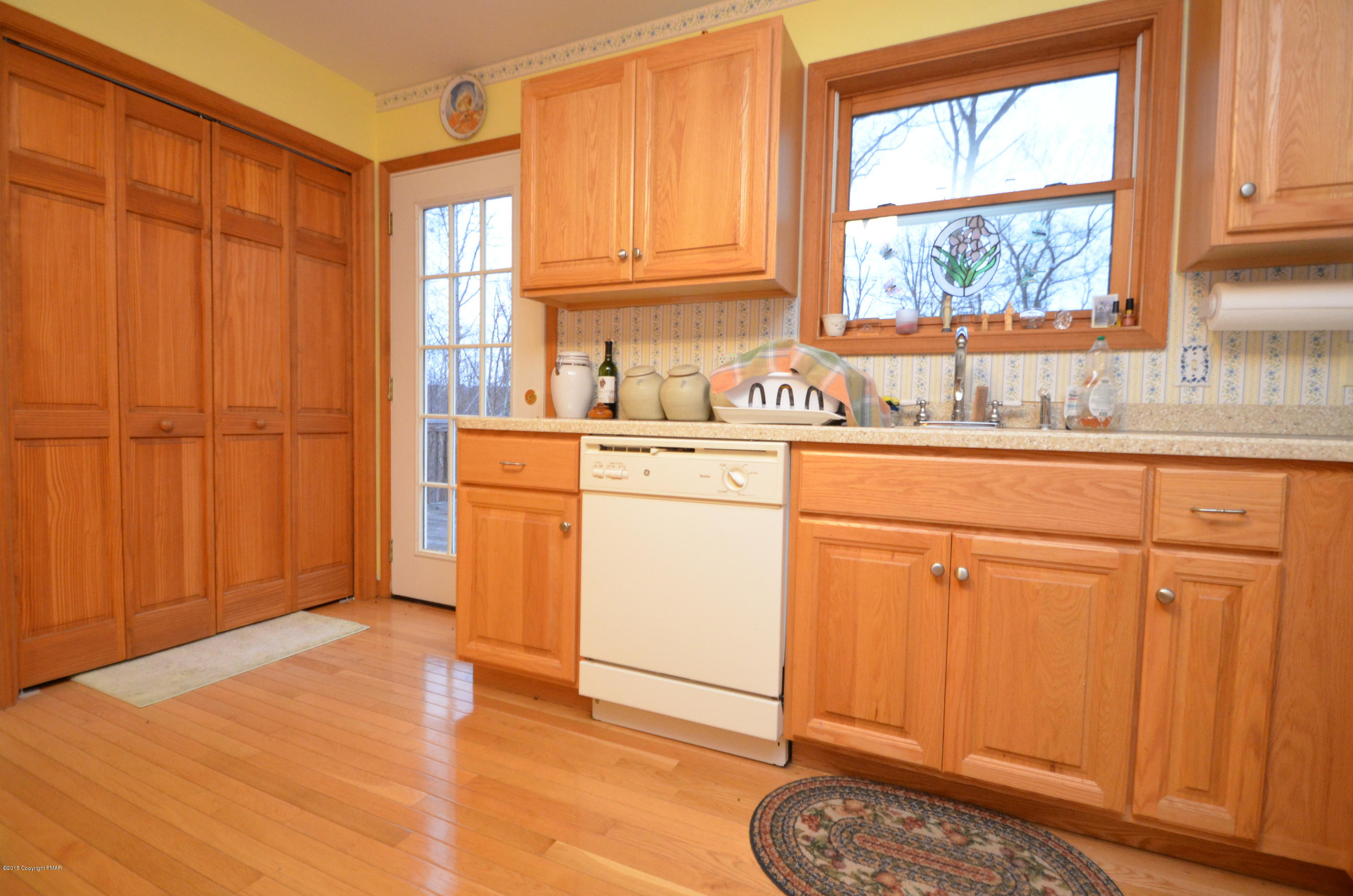 699 Buckle Boot Road Henryville, PA 18332 - Photo 7 of 26 a kitchen with granite countertop cabinets stainless steel appliances a sink and a window