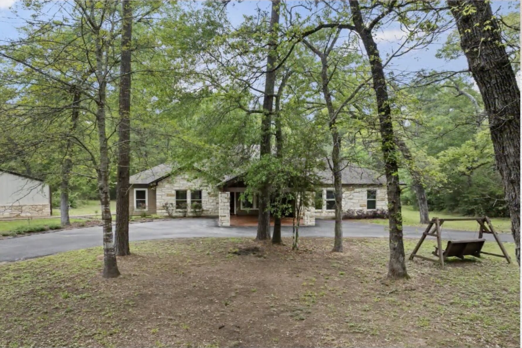 30338 Riley Road Waller, TX 77484 - Photo 6 of 46 a view of a town with large trees and a barn