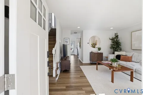 a living room with furniture and a rug
