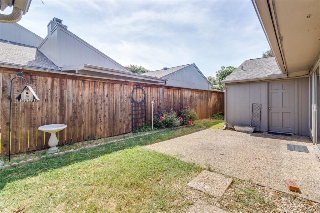 9547 Highland View Drive Dallas, TX 75238 - Photo 13 of 19 Fenced backyard with a patio area