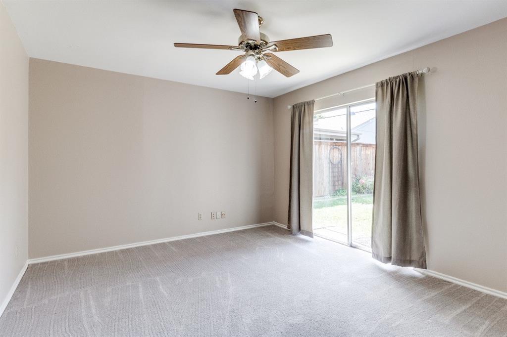 9547 Highland View Drive Dallas, TX 75238 - Photo 18 of 19 2nd bedroom with sliding door to patio