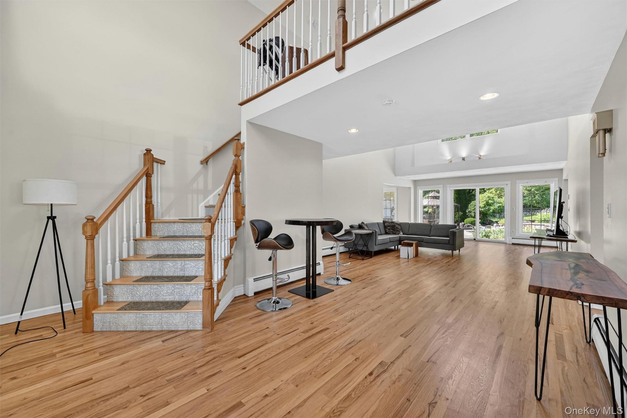 954 Ridgebury Road New Hampton, NY 10958 - Photo 8 of 45 The moment you step inside, the home opens up with soaring ceilings, hardwood floors, and a bright, comfortable layout made for everyday living.