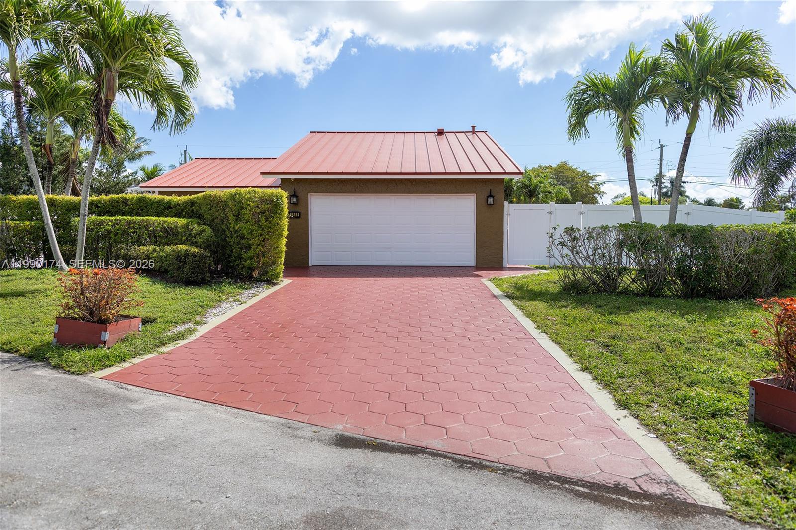 4548 Southwest 28th Way Dania Beach, FL 33312 - Photo 1 of 63 a view of a house with a yard and palm trees
