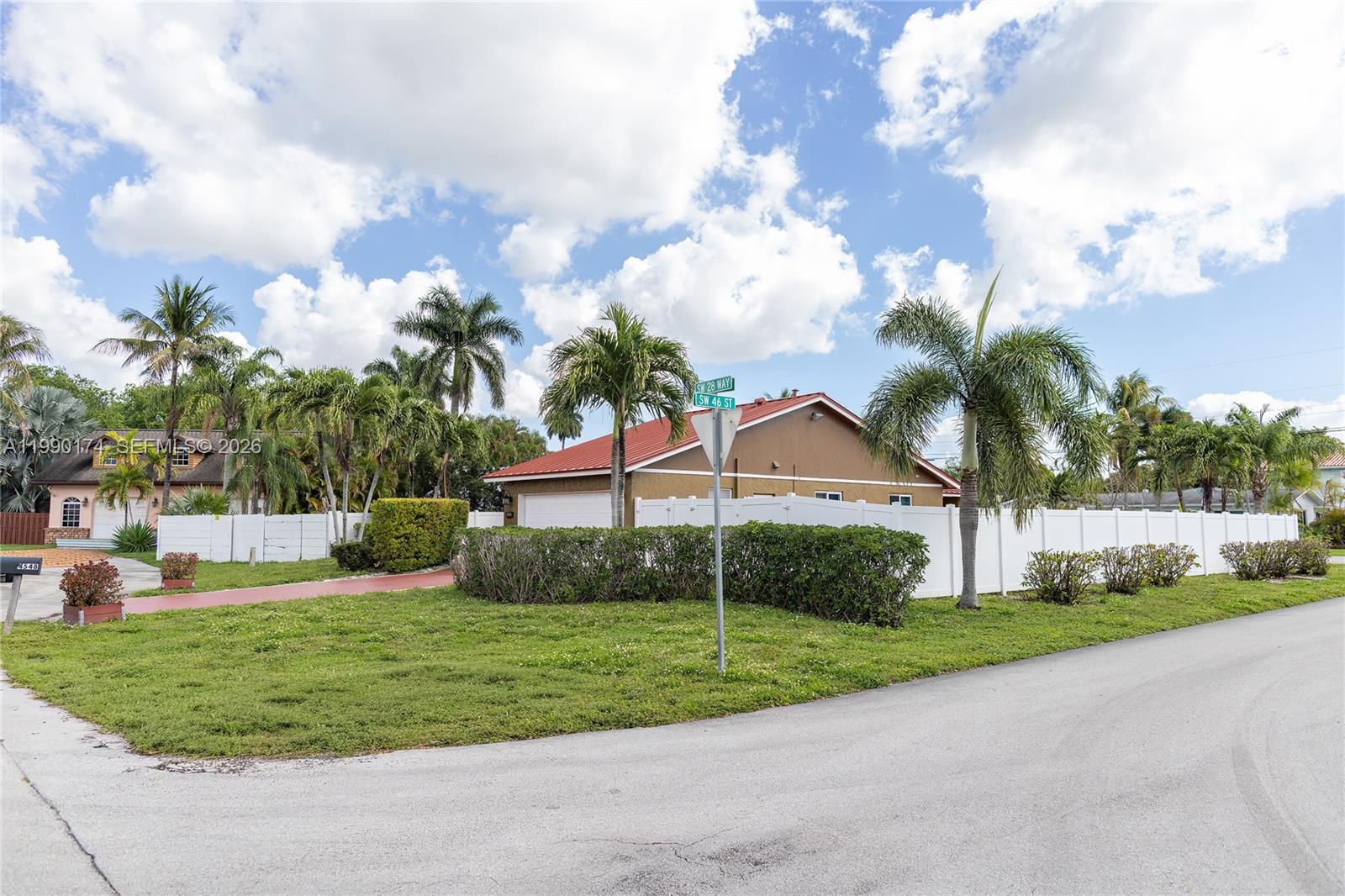 4548 Southwest 28th Way Dania Beach, FL 33312 - Photo 11 of 63 a view of a house with a big yard and a garden