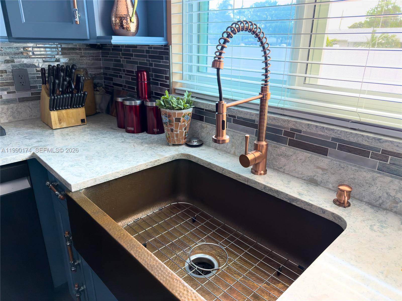 4548 Southwest 28th Way Dania Beach, FL 33312 - Photo 20 of 63 a kitchen with a sink and a stove