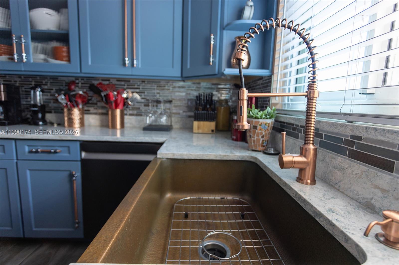 4548 Southwest 28th Way Dania Beach, FL 33312 - Photo 21 of 63 a kitchen with kitchen island granite countertop a sink and a stove