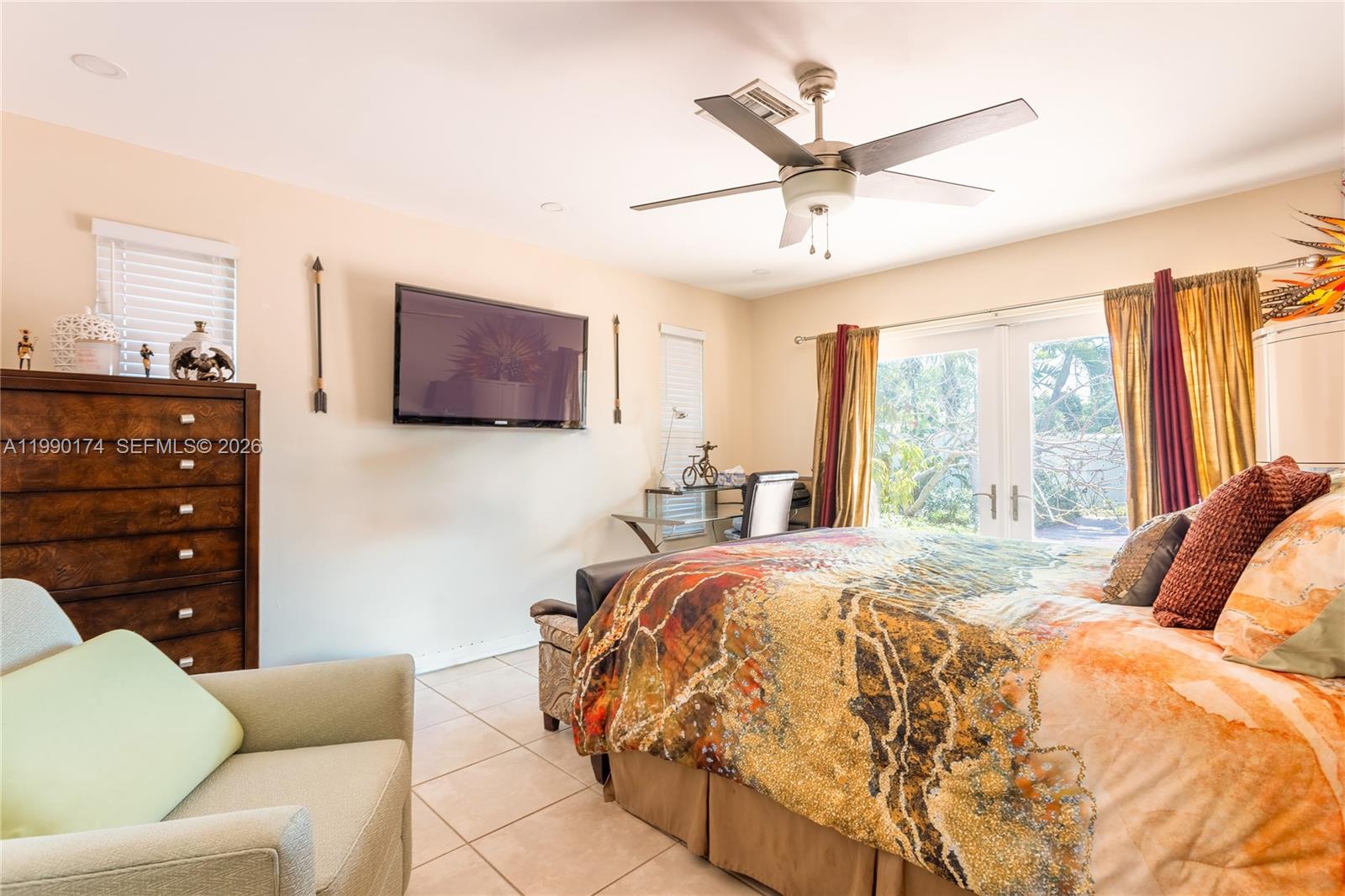 4548 Southwest 28th Way Dania Beach, FL 33312 - Photo 24 of 63 a bed room with a bed a couch and a window