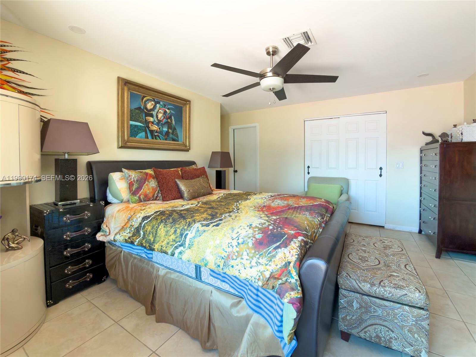 4548 Southwest 28th Way Dania Beach, FL 33312 - Photo 25 of 63 a bedroom with a bed and wooden floor