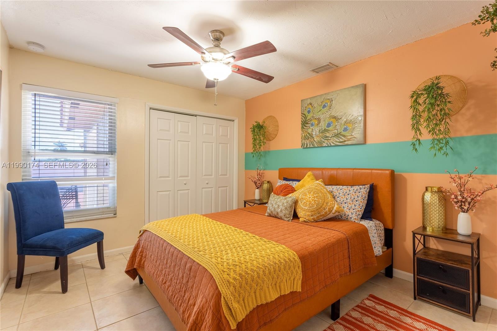 4548 Southwest 28th Way Dania Beach, FL 33312 - Photo 31 of 63 a bedroom with a bed a chair and a potted plant