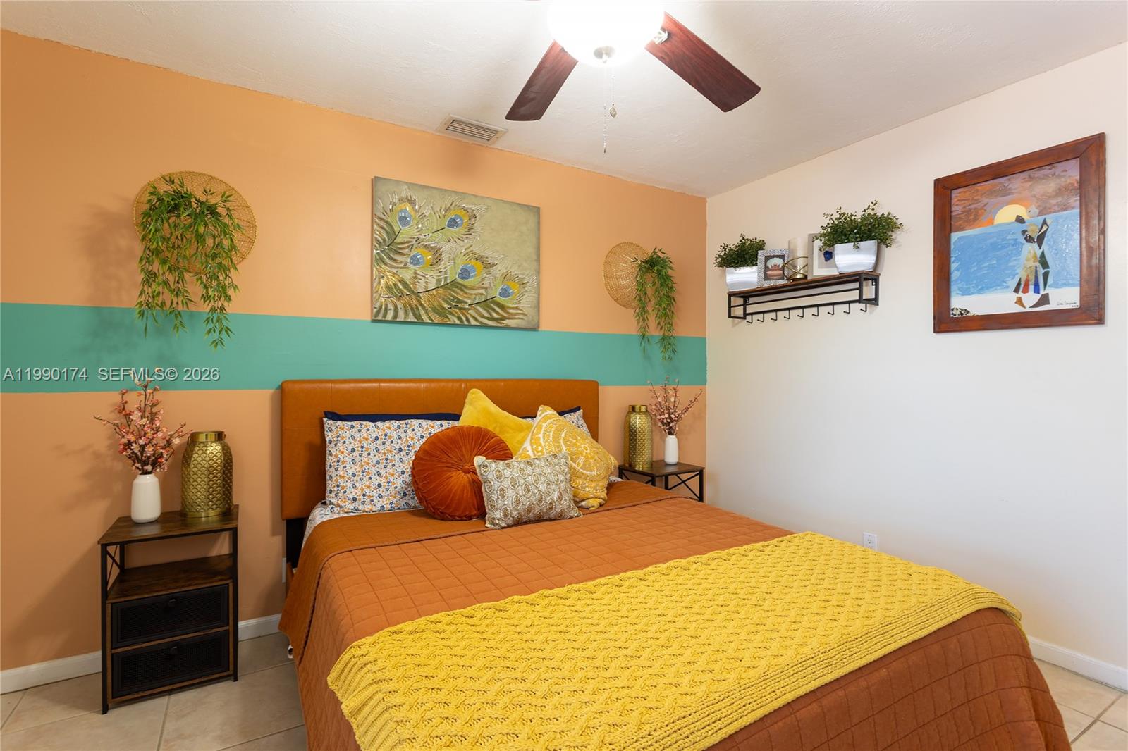 4548 Southwest 28th Way Dania Beach, FL 33312 - Photo 32 of 63 a bedroom with a bed and a painting on the wall