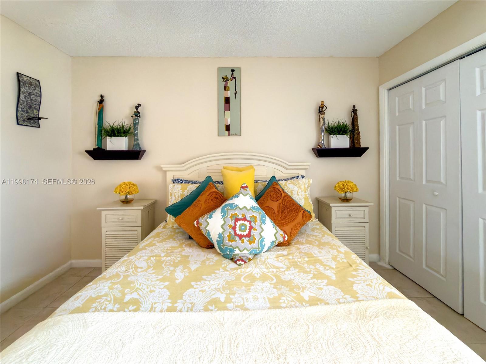 4548 Southwest 28th Way Dania Beach, FL 33312 - Photo 35 of 63 a bedroom with a bed and wooden floor