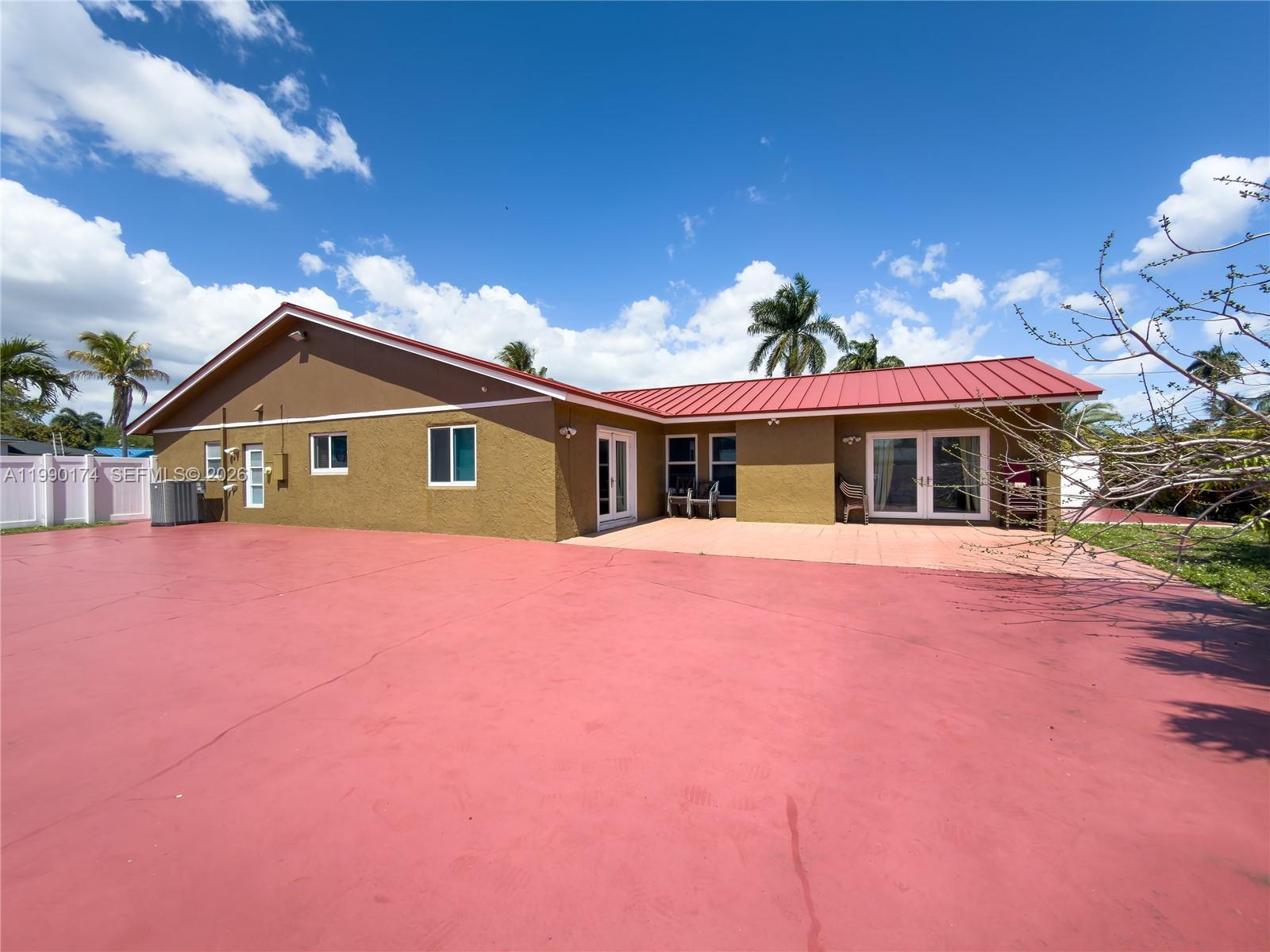 4548 Southwest 28th Way Dania Beach, FL 33312 - Photo 45 of 63 a front view of a house with a yard
