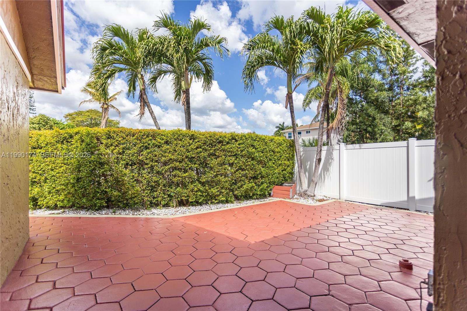 4548 Southwest 28th Way Dania Beach, FL 33312 - Photo 5 of 63 a view of a yard with a flower in a garden