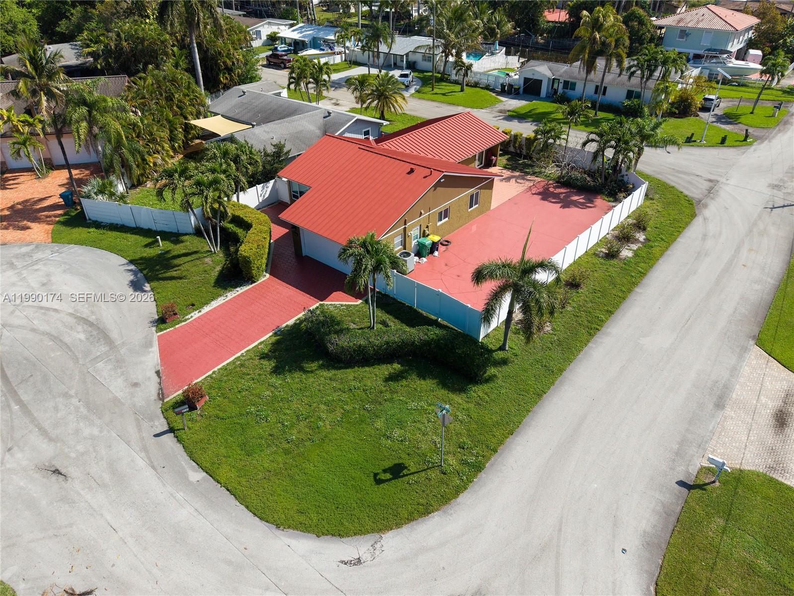 4548 Southwest 28th Way Dania Beach, FL 33312 - Photo 51 of 63 an aerial view of a house with a garden and swimming pool