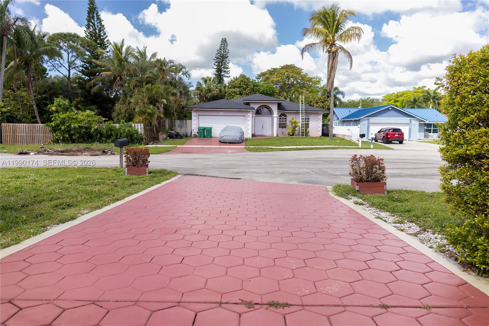 4548 Southwest 28th Way Dania Beach, FL 33312 - Photo 54 of 63 a front view of a house with a yard and a garden
