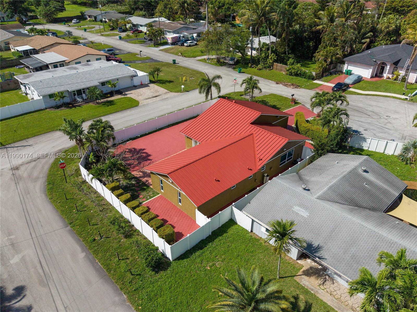 4548 Southwest 28th Way Dania Beach, FL 33312 - Photo 57 of 63 an aerial view of a tennis ground and a cars park side of the road