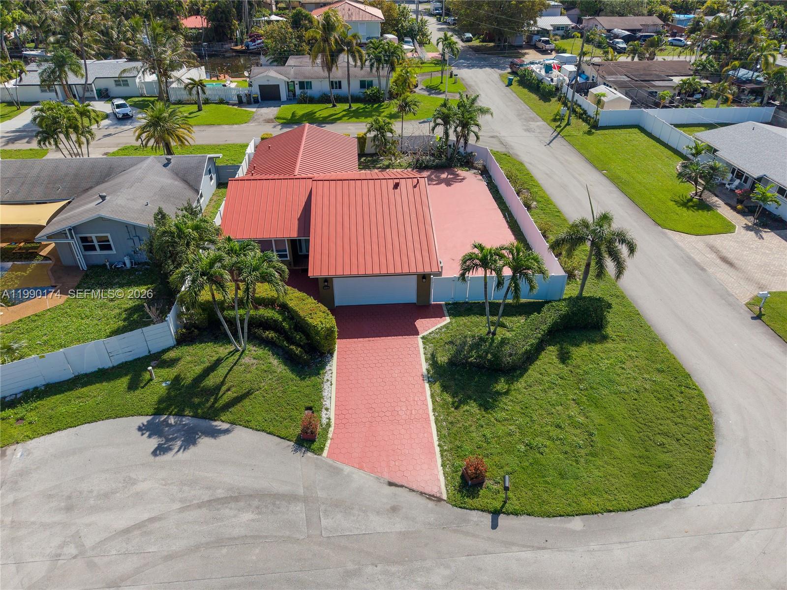 4548 Southwest 28th Way Dania Beach, FL 33312 - Photo 62 of 63 an aerial view of a house with a garden and swimming pool