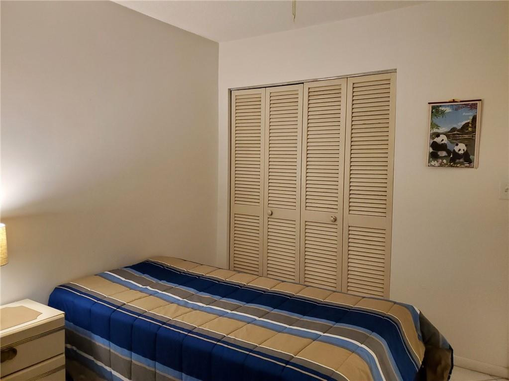 5300 Washington Street, Unit H136 Hollywood, FL 33021 - Photo 25 of 38 a view of a room with a bed and a window