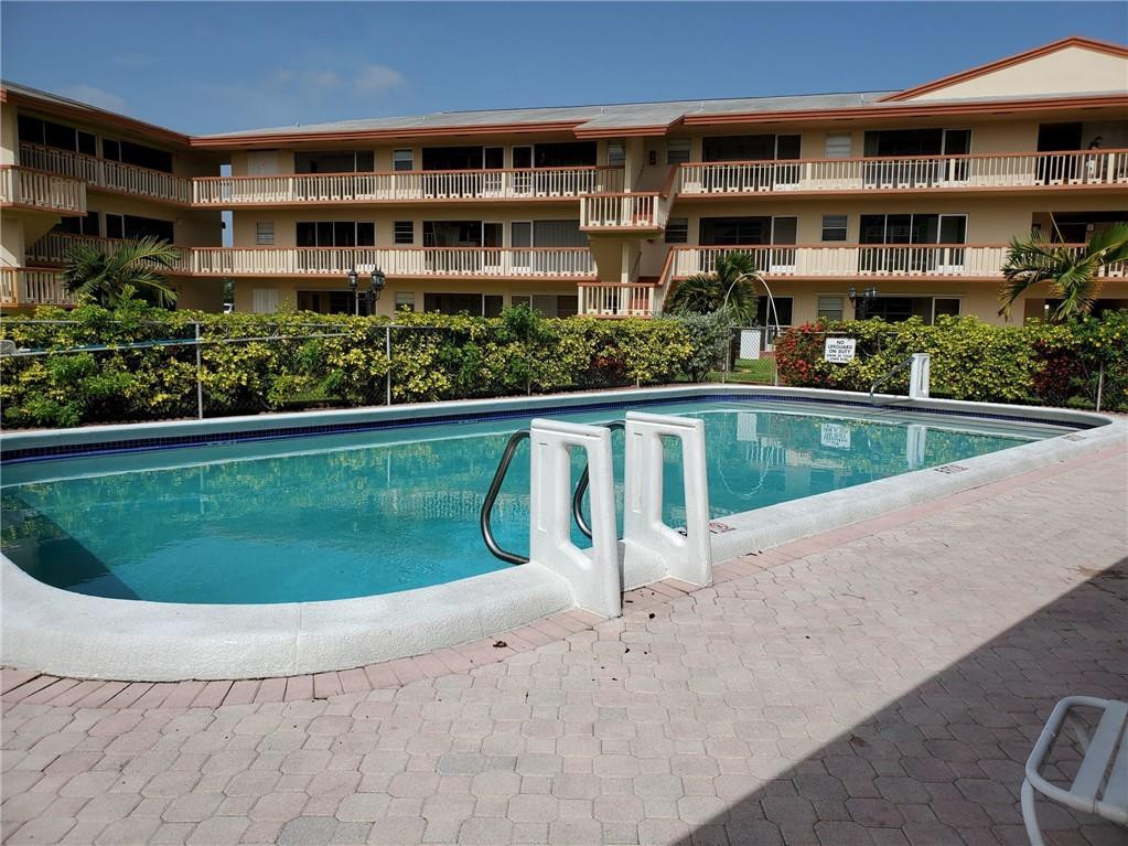 5300 Washington Street, Unit H136 Hollywood, FL 33021 - Photo 30 of 38 a view of a house with a swimming pool