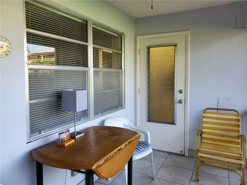 5300 Washington Street, Unit H136 Hollywood, FL 33021 - Photo 4 of 38 a backyard of a house with barbeque oven table and chairs