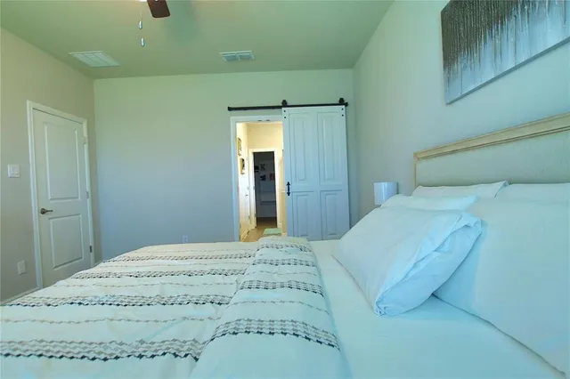 a bedroom with a bed and a cabinets