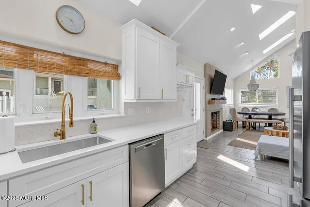 a bedroom with a bed wooden floor and window