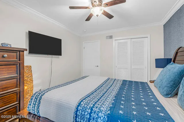 a view of a balcony with chairs and wooden floor