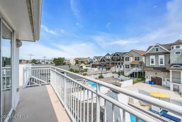 a view of a swimming pool with lounge chairs
