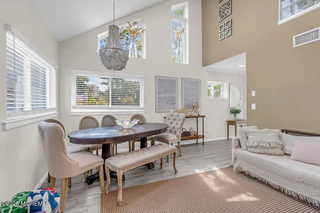 a kitchen with stainless steel appliances granite countertop a sink a stove and a window