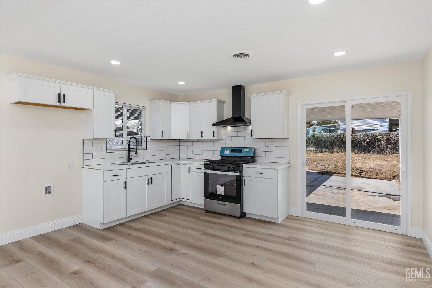 Undisclosed Address Bakersfield, CA 93312 - Photo 11 of 23 a kitchen with stainless steel appliances granite countertop a stove a sink and a refrigerator
